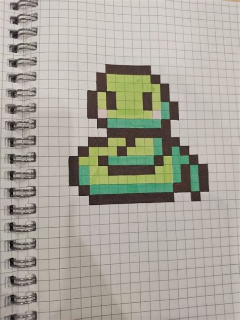 A Notebook With An Image Of A Cartoon Character In Pixel Art On The