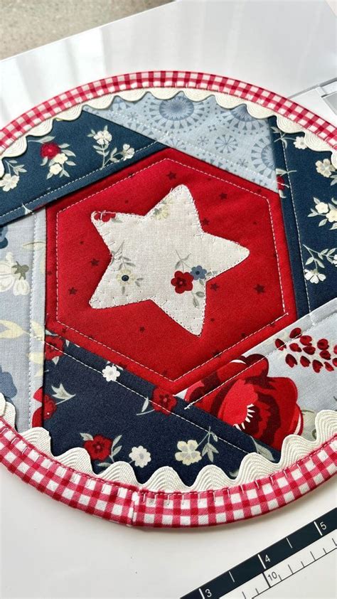 A Red White And Blue Patchwork Plate With A Star On It