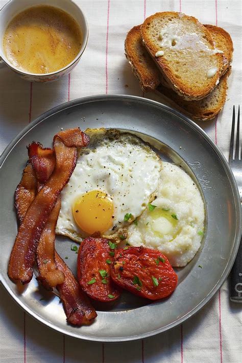 Breakfast Eggs Bacon Grits Stewed Tomatoes And A Side Of Toast With Coffee Photograph By