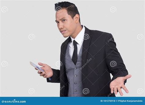 Indignant Asian Businessman Having Problem With Smartphone Clueless