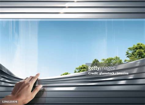 Hand Pulling Blinds Photos And Premium High Res Pictures Getty Images