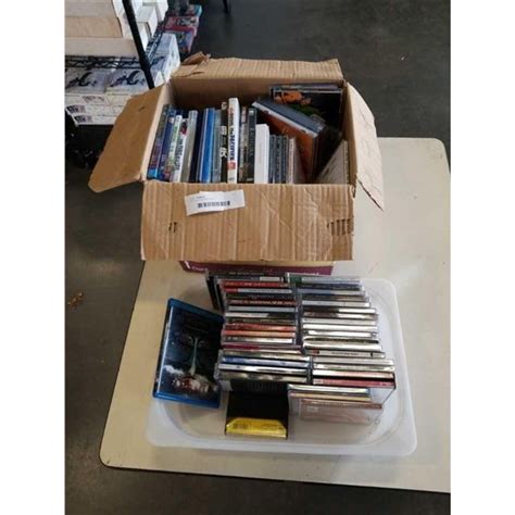 LOT OF CDS AND DVDS - Big Valley Auction