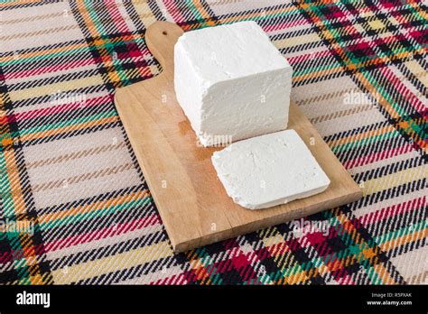 Cutting Traditional Bulgarian Salty White Cheese With A Knife First