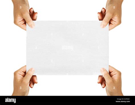 Four Hands Holding Sheet Of Paper Isolated On White Background Stock