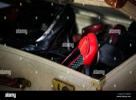 Box full of womens shoes in old fashioned army demob suitcase Stock ...