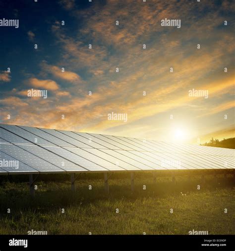 Solar Panels Under Blue Sky On Sunset Stock Photo Alamy