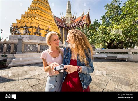 Beautiful women visiting Bangkok attractions and landmarks in Thailand ...