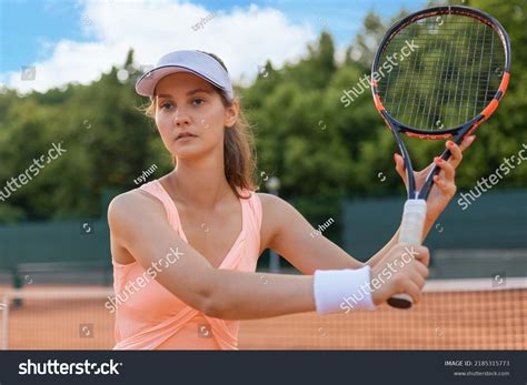 Professional Equipped Female Tennis Player Beating Stock Photo