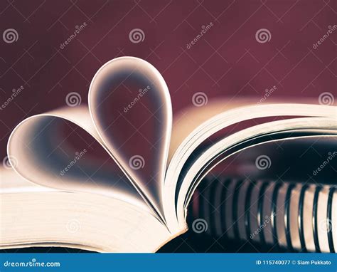 Closeup Soft Focus Pages Of A Book Curved Into A Heart Shape Stock