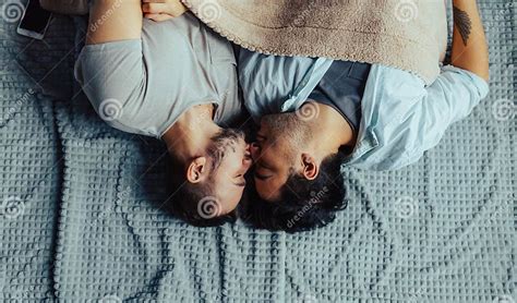 Handsome Sleepy Man With Bristle Kissing Good Night Male Partner Lying