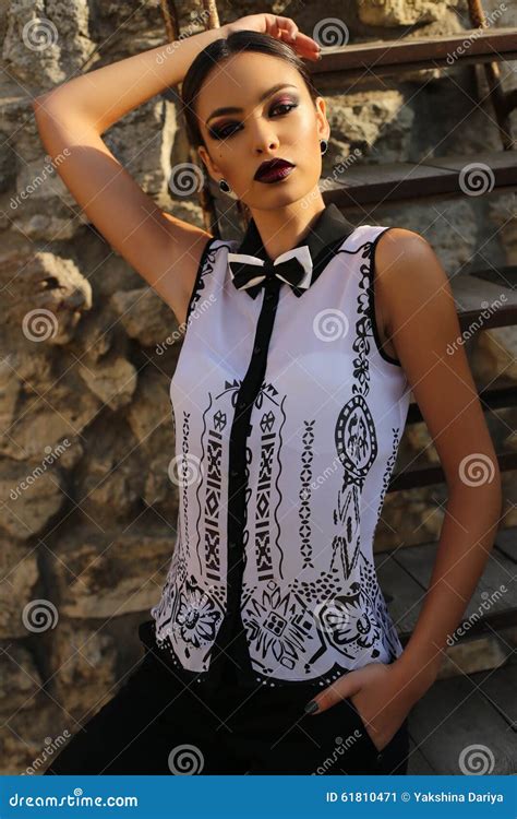 Elegant Woman With Dark Hair Wearing A White Shirt And Black Pants Stock Image Image Of Blouse