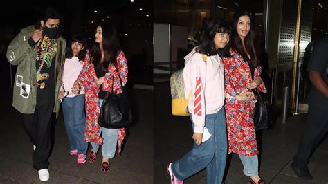 Aishwarya Rai Bachchan Returns From Cannes Film Festival With Abhishek