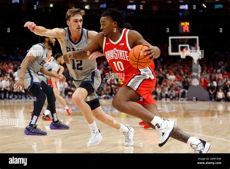 Ohio State Forward Brice Sensabaugh Right Drives Against Robert