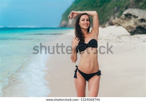 Sexy Brunette Girl Swimsuit Sunbathes On Stock Photo 1324068746 Shutterstock