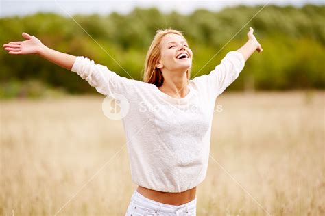 Image Of Happy Woman With Outstretched Arms Standing In Field Royalty