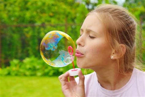 Beautiful Girl Inflates Soap Bubbles Cheerful Happy Action At The