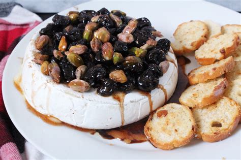 Baked Brie With Balsamic Cherries Pistachios And Cinnamon Honey Zest And Simmer