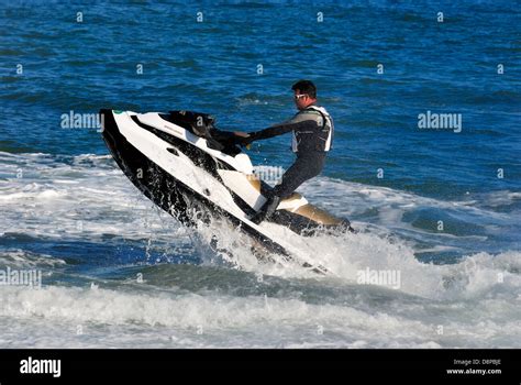 Man Riding A Jetski Dorset England Uk Stock Photo Alamy