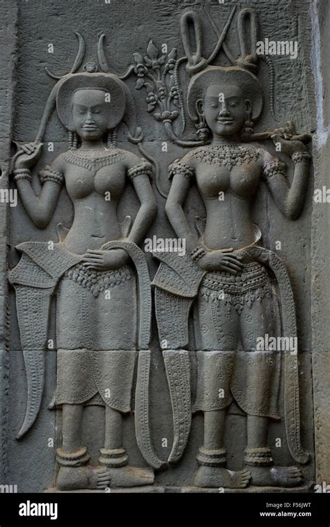 Wall bas-relief of Devatas in Angkor Wat temple in Siem Reap, Cambodia ...