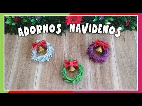 Three Christmas Wreaths With Bows And Bells On Them