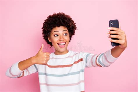 Photo Of Pretty Excited Dark Skin Lady Holding Telephone Making Selfies