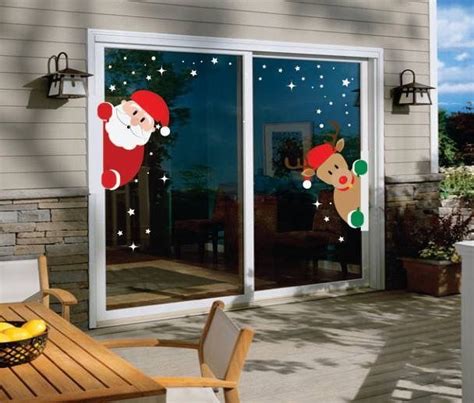 An Outside Patio With Christmas Decorations On The Sliding Glass Doors