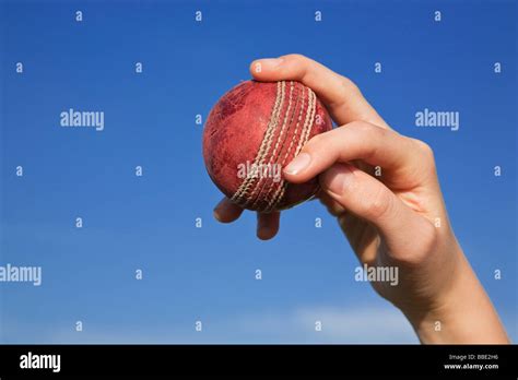 Close up of spin bowler bowling a cricket ball Stock Photo - Alamy