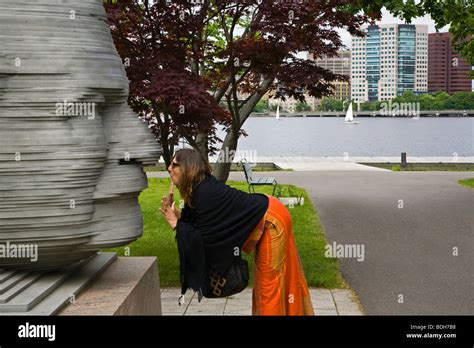 Tourist Engages With A Statue Of ARTHUR FIEDLER The Conductor Of The