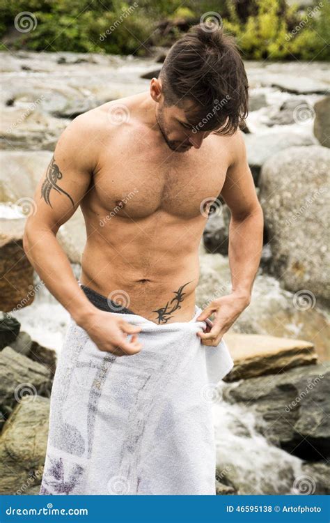 Handsome Muscular Young Man Outdoor Wearing Only Towel Stock Photo