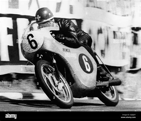 Switzerlands Luigi Taveri Riding A Honda Speeding Out Of The Dip At