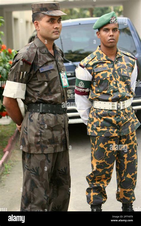 Bangladeshi Paramilitary Border Guards Look On As One Of Them Left Is