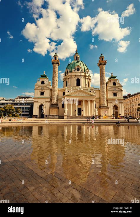 Reflection of Karlskirche in the city of Vienna, Austria Stock Photo ...