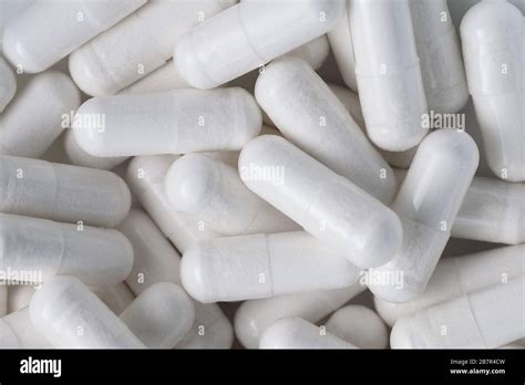 Top View Closeup Pile Of White Antibiotic Capsule Pills Texture