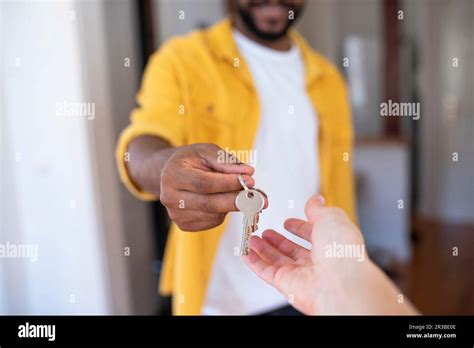 Real Estate Agent Giving House Keys To Man Stock Photo Alamy