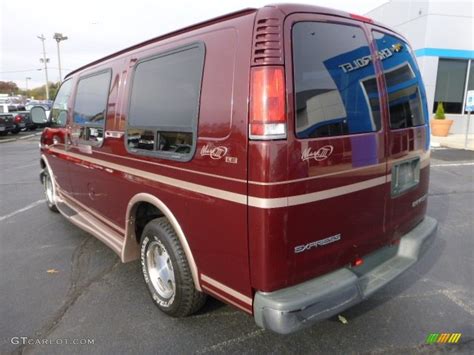 1999 Dark Carmine Red Metallic Chevrolet Express 1500 Passenger Conversion Van 87523729 Photo