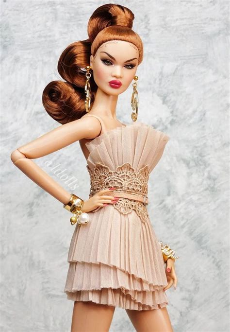 A Barbie Doll Wearing A Dress And High Heels With Her Hands On Her Hips