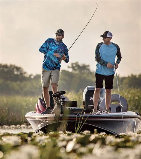 two men fishing off of boat