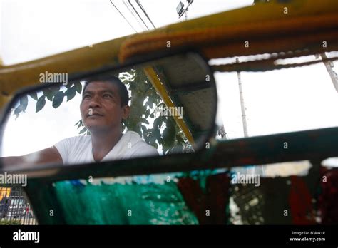 Carlo Ticar A Filipino Pedicab Driver Wait For Tourists Along