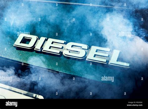 Diesel signs on a car in exhaust gas, symbolic photo diesel scandal ...