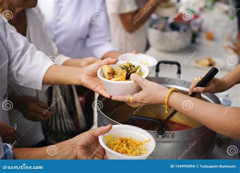 Charity Food Is Free For People In Slums Hands Of Volunteers Serves