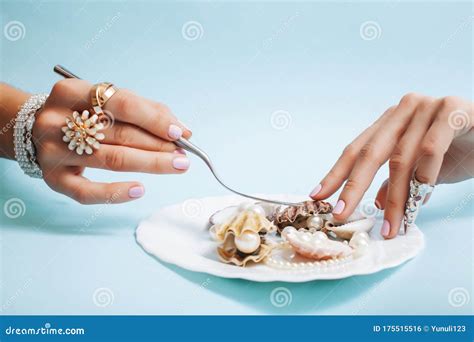 Beautiful Woman Hands With Pink Manicure Holding Plate With Pearls And