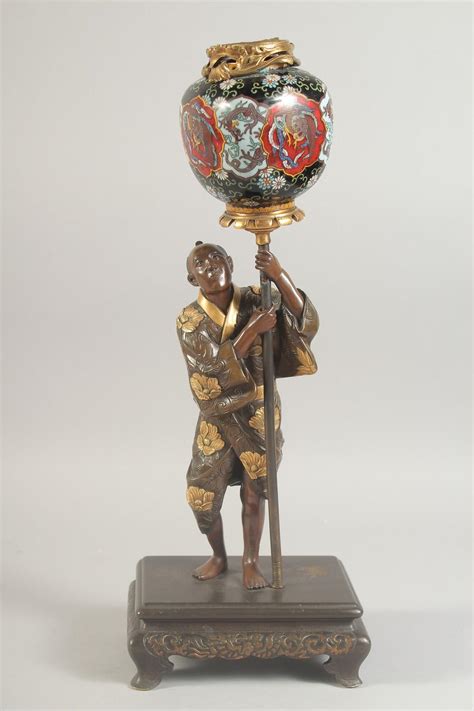 At Auction A Fine Japanese Meiji Period Bronze Okimono Holding A