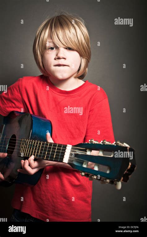 Child playing the guitar Stock Photo - Alamy