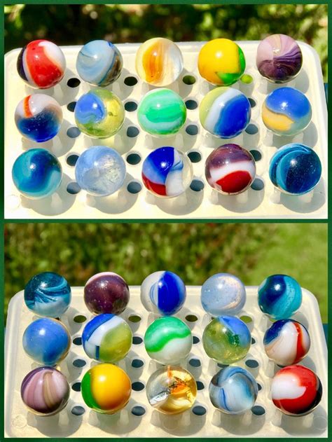 An Egg Carton Filled With Different Colored Marbles