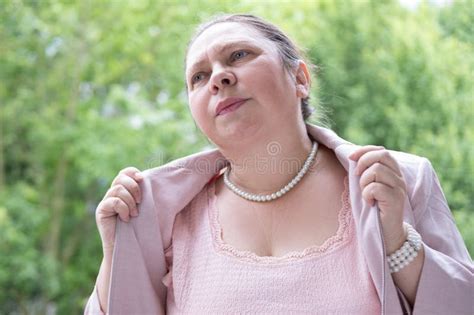 Mature Woman 55 Elegantly Dressed In Pink Feeling Unwell Fans