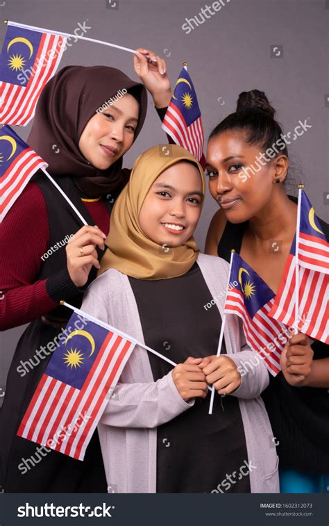 Happy Multi Racial Malaysian People Holding Stock Photo 1602312073 ...