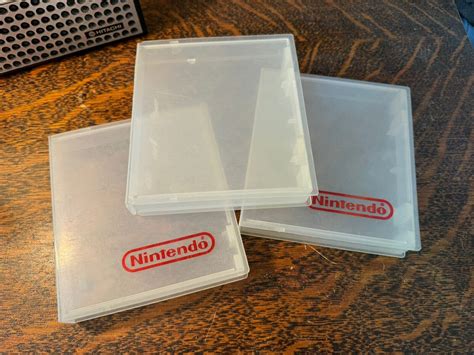 Nintendo Lot Clear Plastic Nes Logo Cartridge Hard Clamshell Game