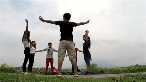 Group Of Amateur Teen Students Are Taught Dancing By Tutor At Lake Side