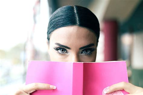 8100 Woman Holding Book To Face Stock Photos Pictures And Royalty Free