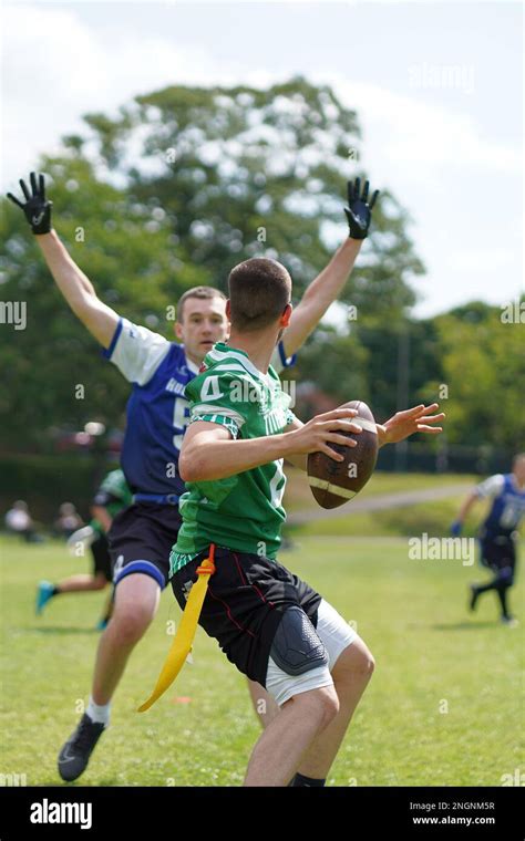 Rusher Pressuring The Quaterback During A Flag Football Game In Wales